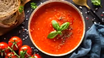 Bowl of soup with Tomatoes and bread
